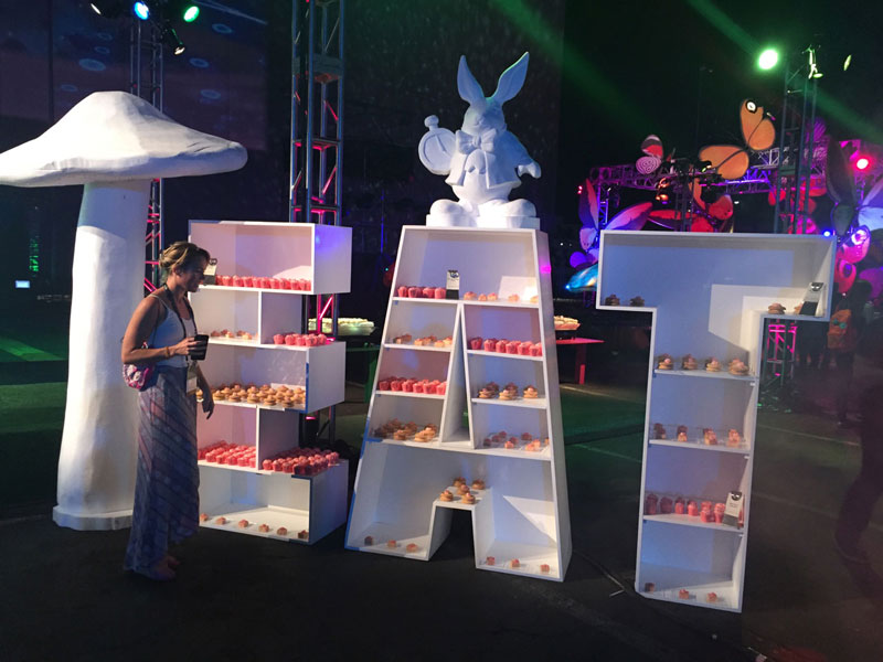 An excited Laura Avery at the Sweets table for the Adobe Max Las Vegas Bash